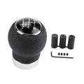 Perforated black leather 5-speed shift knob with chrome gear dial and included adapters