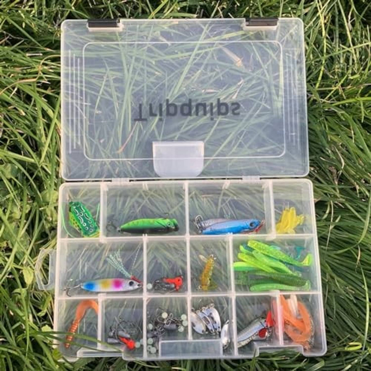 Open clear tackle tray storage box with multiple divided sections and black latches