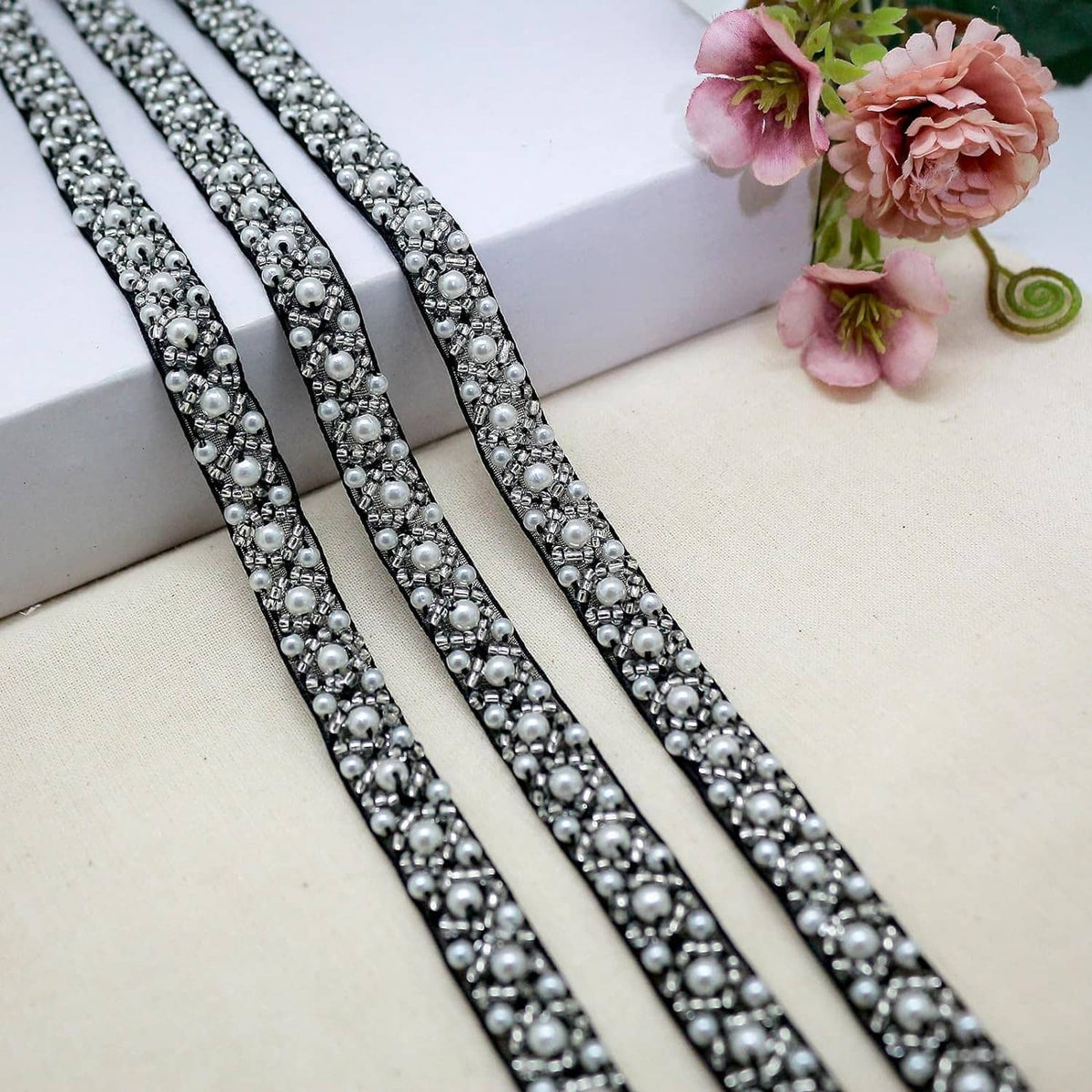 Black pearl beaded trim ribbon with silver-white pearls in curved parallel rows