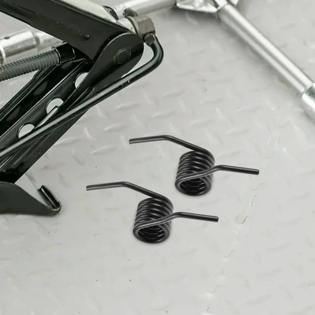 Two black steel jack handle springs with straight ends, tightly coiled.