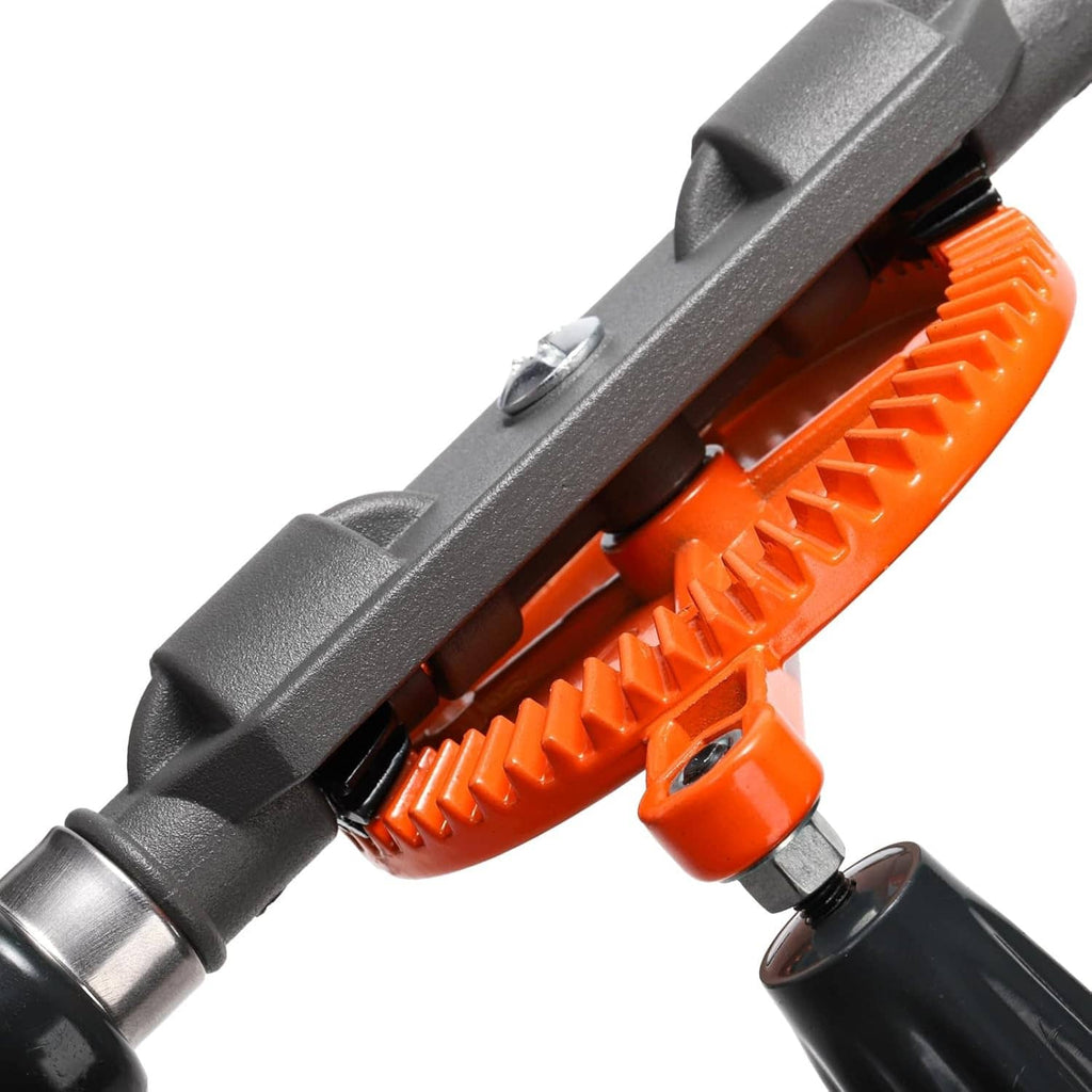 Close-up of manual hand drill orange gear housing and black handle