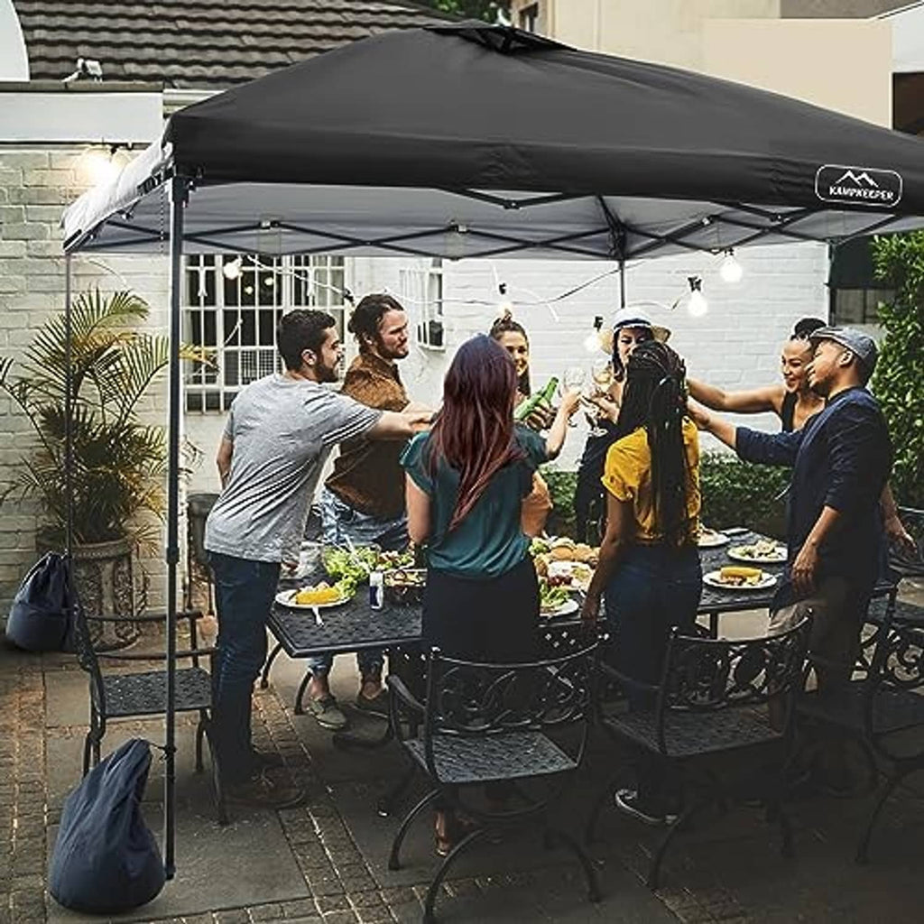 Black pop-up canopy top cover over an event tent frame with hanging light