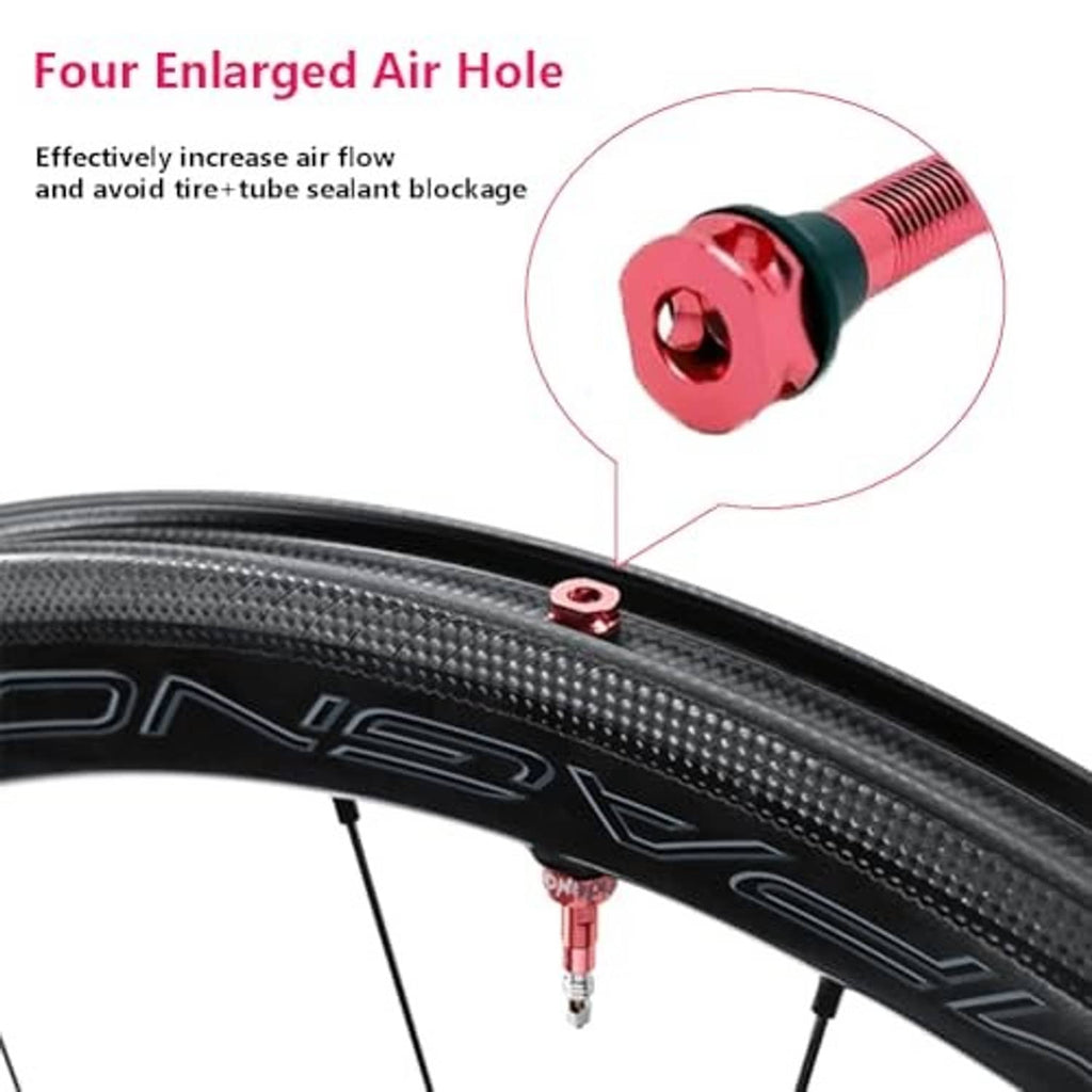 Tubeless valve on tire: close-up of red valve stem and enlarged air hole