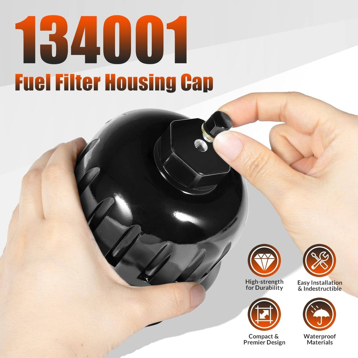 Black fuel filter housing cap with hex bolt top held by two hands