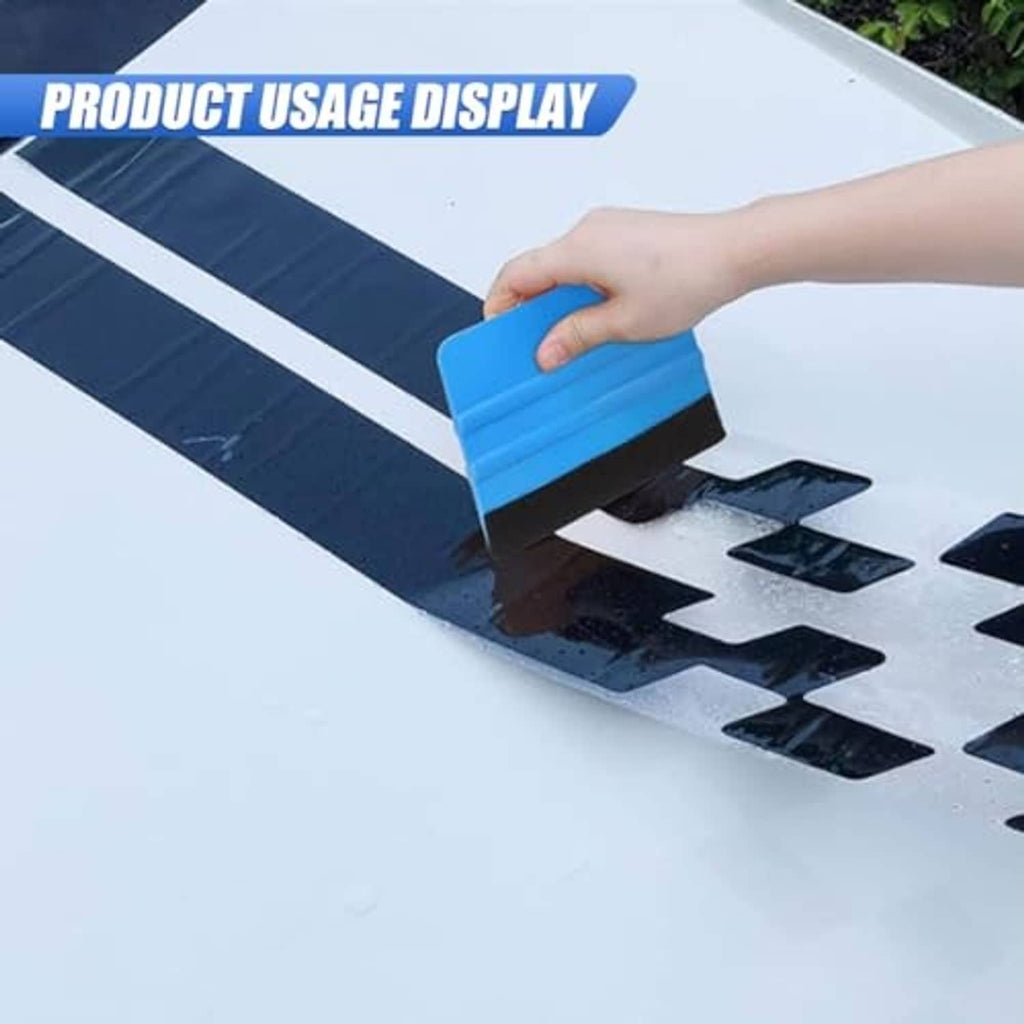 Blue felt-edge squeegee scraper held against the surface by a hand