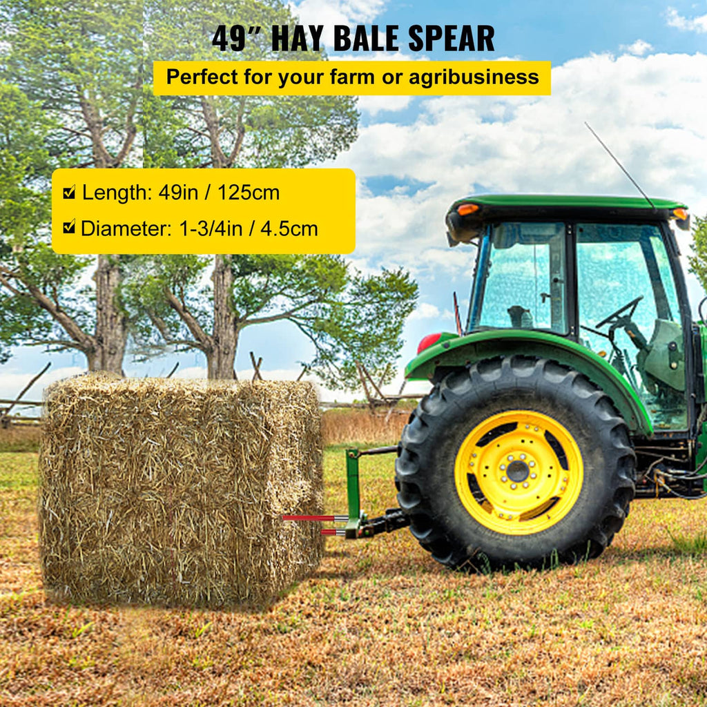Red hay bale spear attachment with two pointed prongs on a loader, farm hay handling