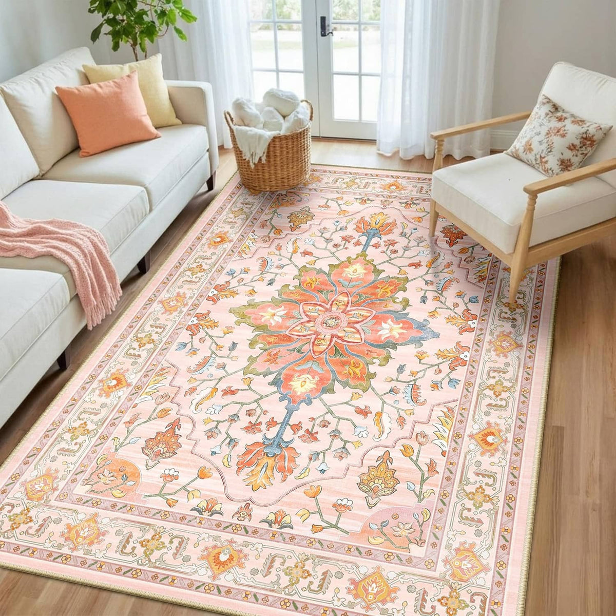 Pink and light pink floral rectangular area rug with ornate border