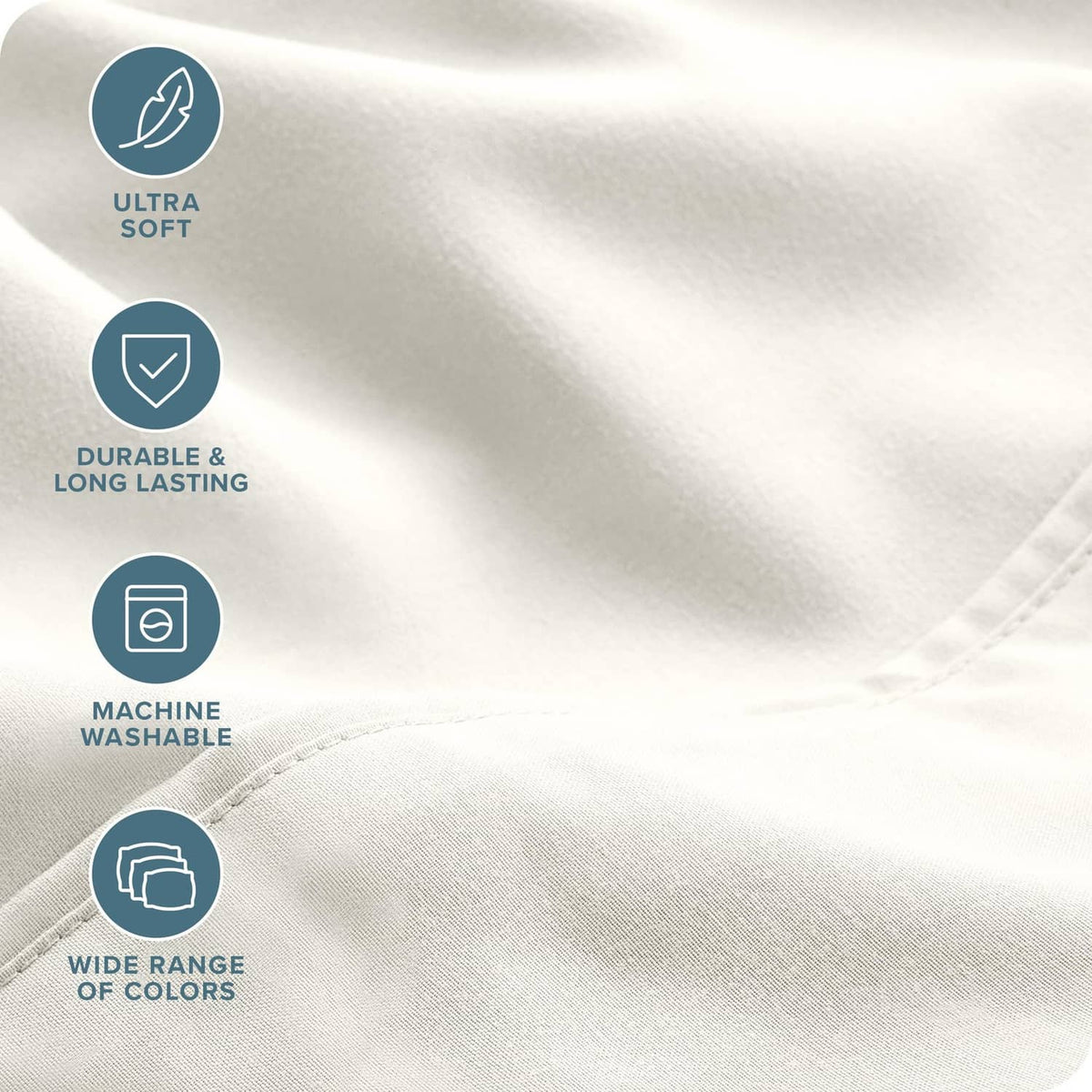 Cream microfiber sheet fabric close-up with stitched seam and textured weave