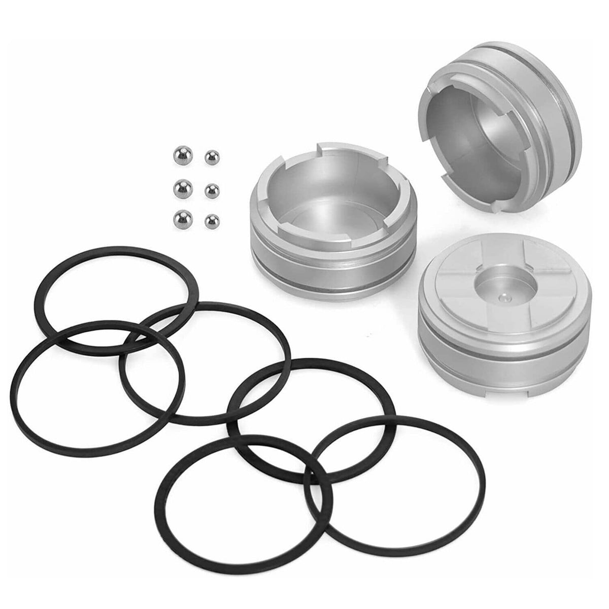 Forward accumulator piston kit components: silver piston halves, steel balls, black seals