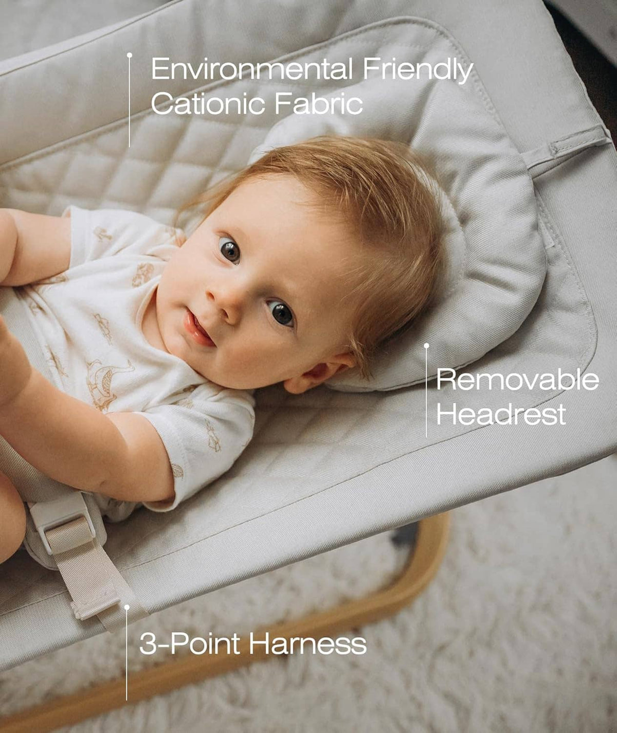 Beige baby bouncer seat featuring removable headrest and 3-point harness straps