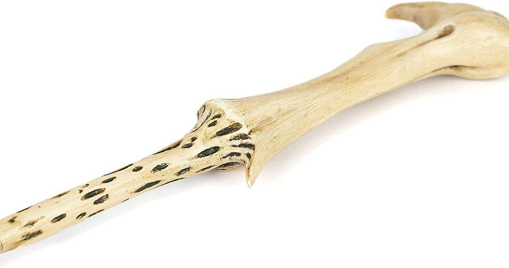 Pale wand barrel with dark speckled pattern and carved handrest