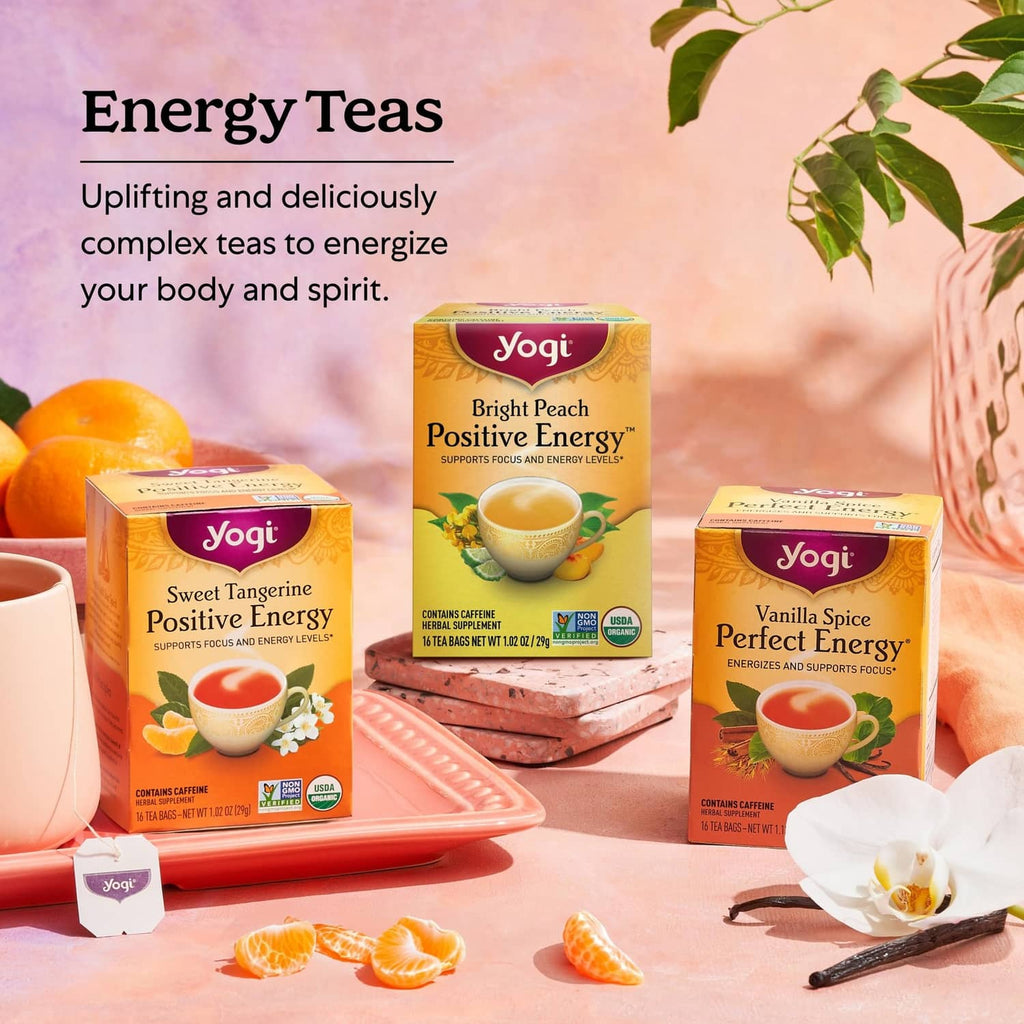 Energy tea sampler with three Yogi boxes and cups on a tray, includes Bright Peach