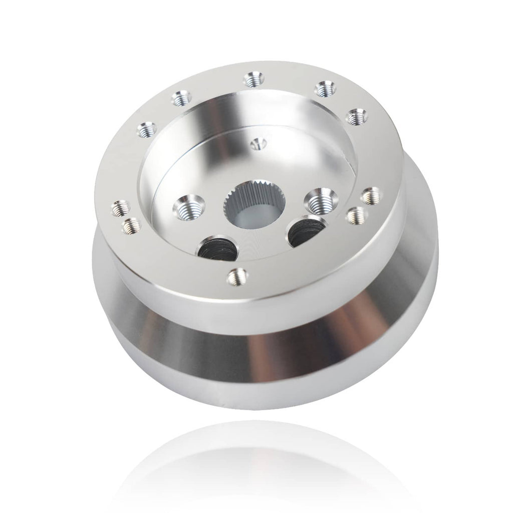 Polished aluminum steering wheel hub adapter with screw holes around recessed center
