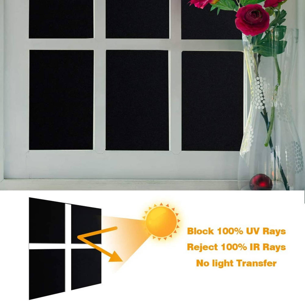 Blackout window film on multi-pane window, blocking light with dark coverage