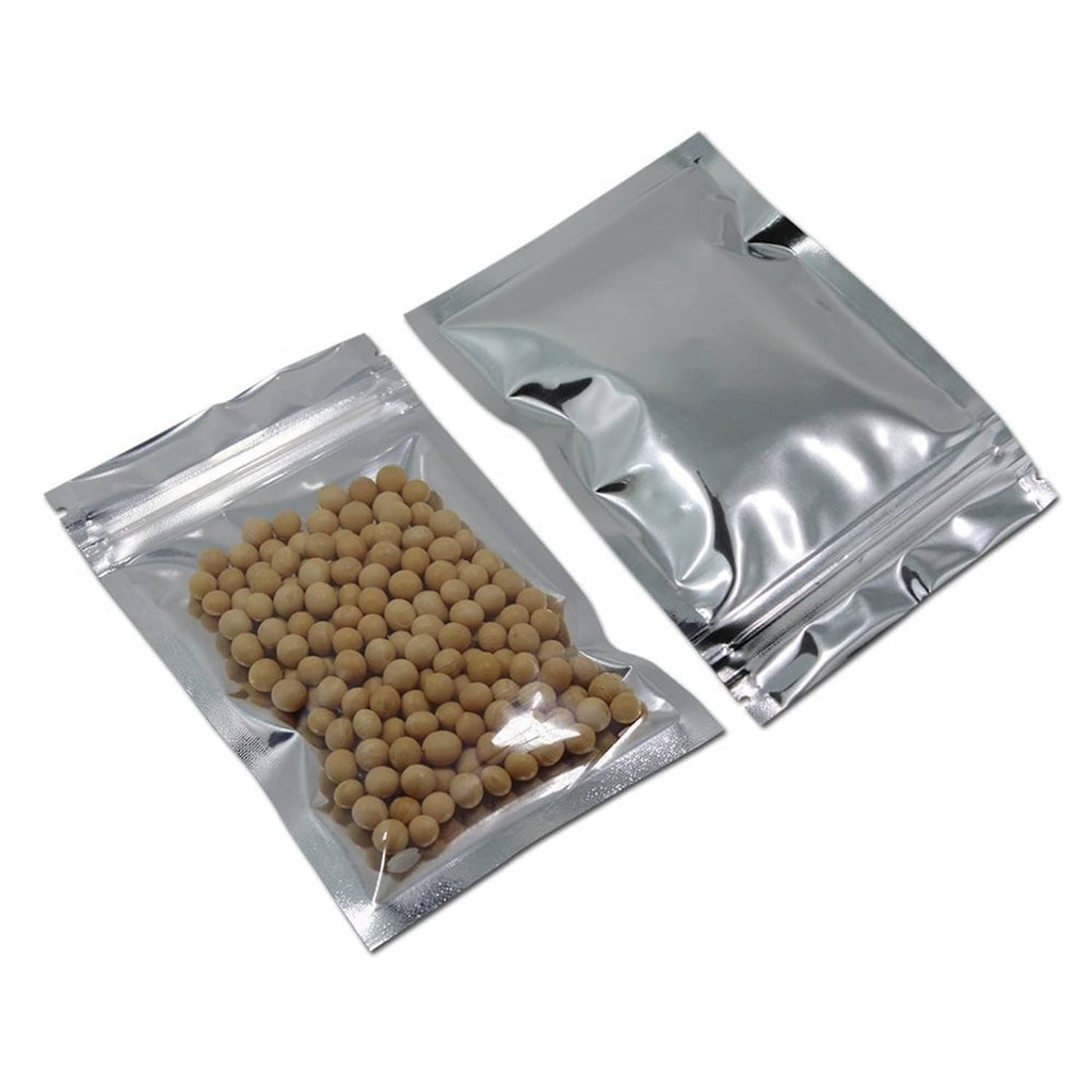 Two clear front resealable mylar bags with small tan round contents