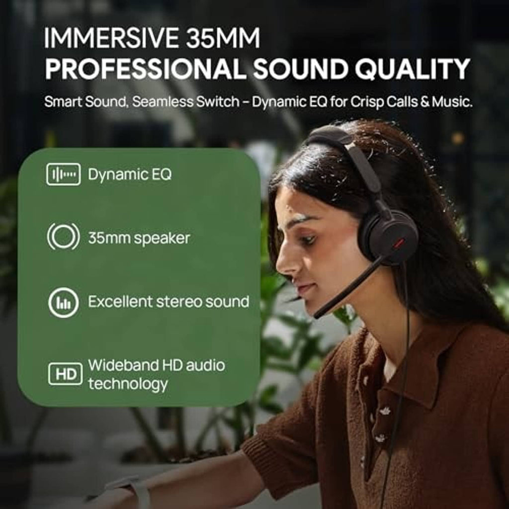 Black wired over-ear headset with boom mic worn by person at workstation