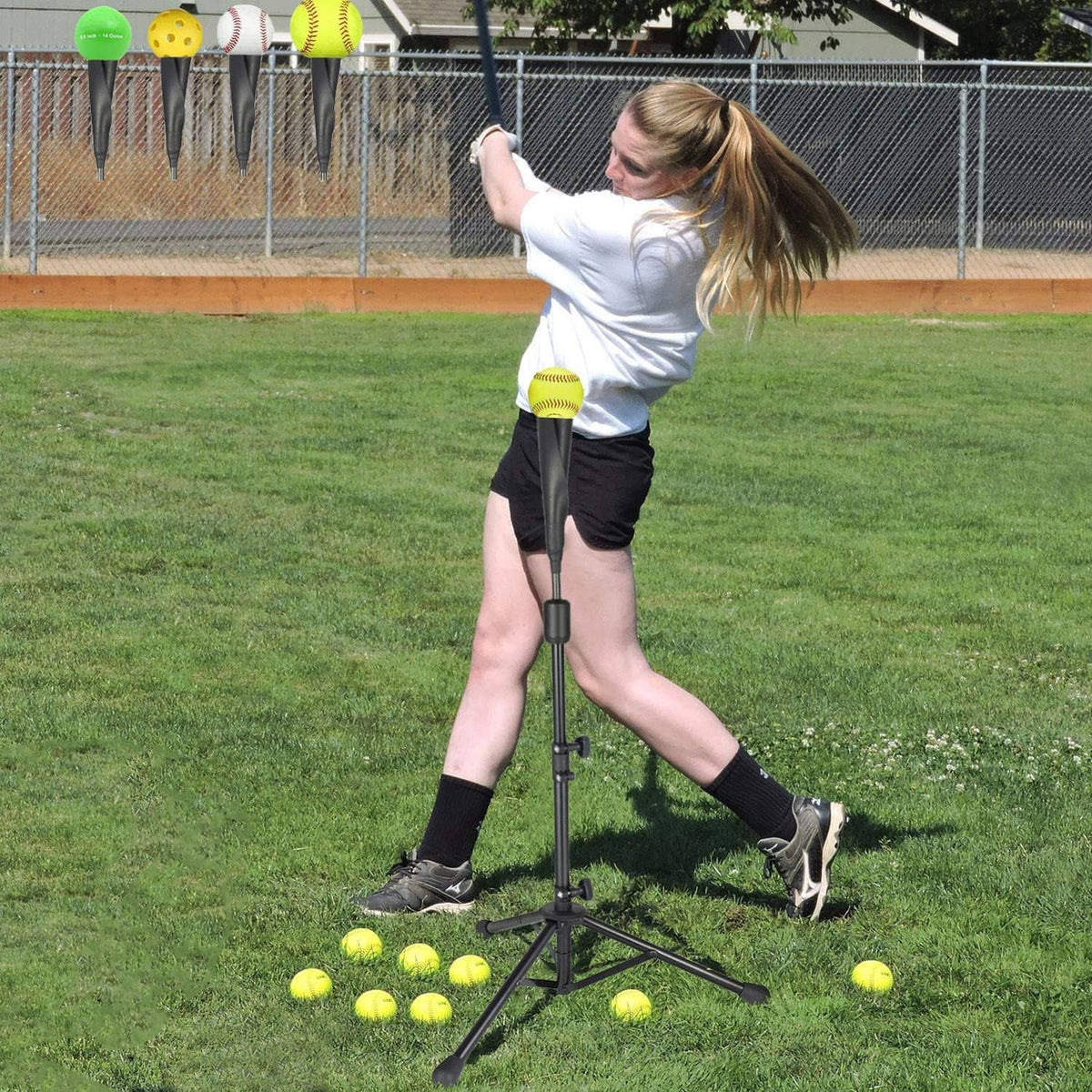 Adjustable baseball tee tripod stand with rubber tee top set on grass for batting.