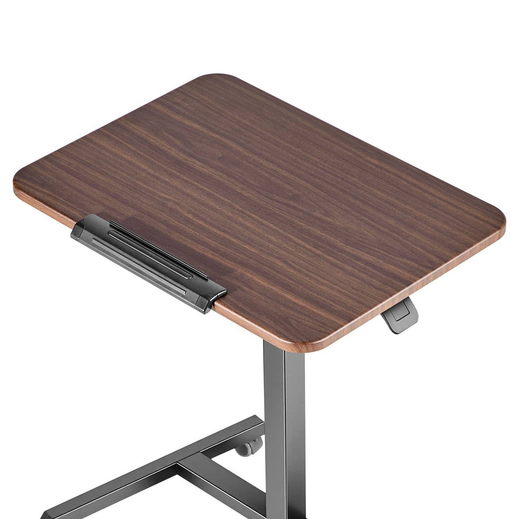 Adjustable height standing desk with dark wood tilting surface, control handle and frame legs