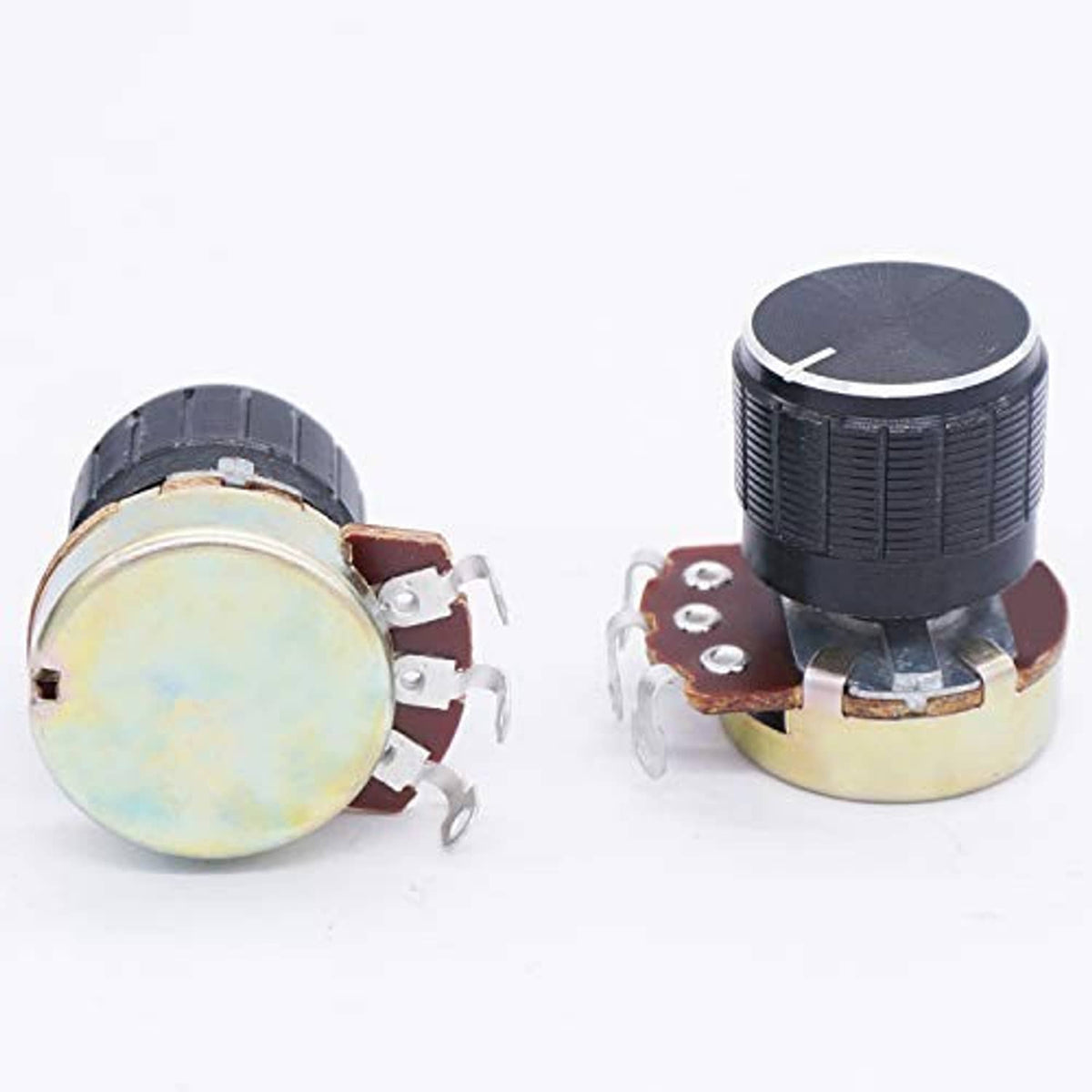 Two single-turn potentiometers showing round metal back plates and black front knobs
