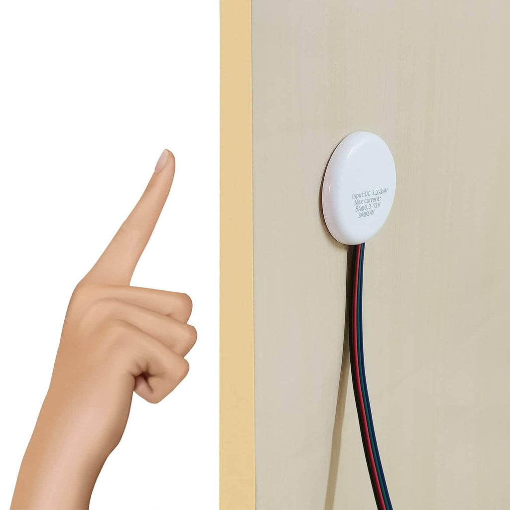 Round white touch dimmer switch mounted on panel with three-color wire leads