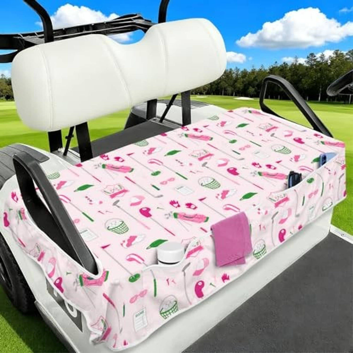 Golf cart seat cover with colorful golf icon print and front pocket, fitted on bench