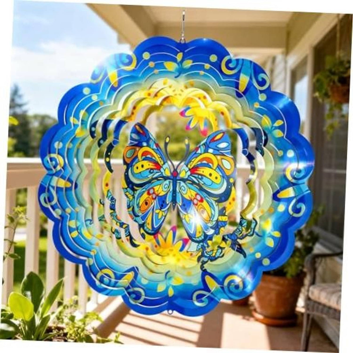 Blue butterfly wind spinner with mirrored metal rings and a colorful butterfly center
