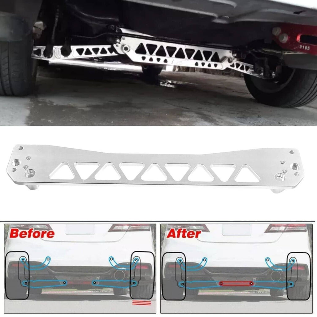 Silver rear subframe brace tie bar installed under a car, with pivot bushings