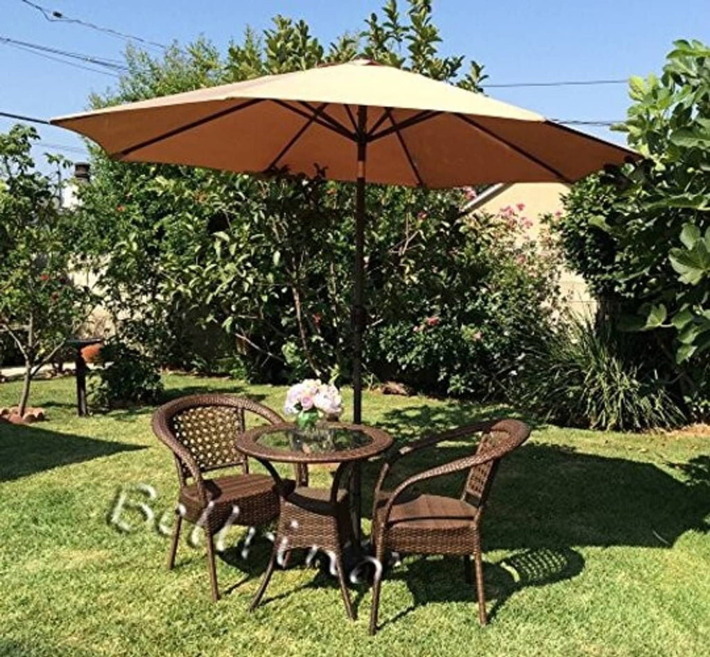 Tan patio umbrella open above an outdoor dining table and chairs