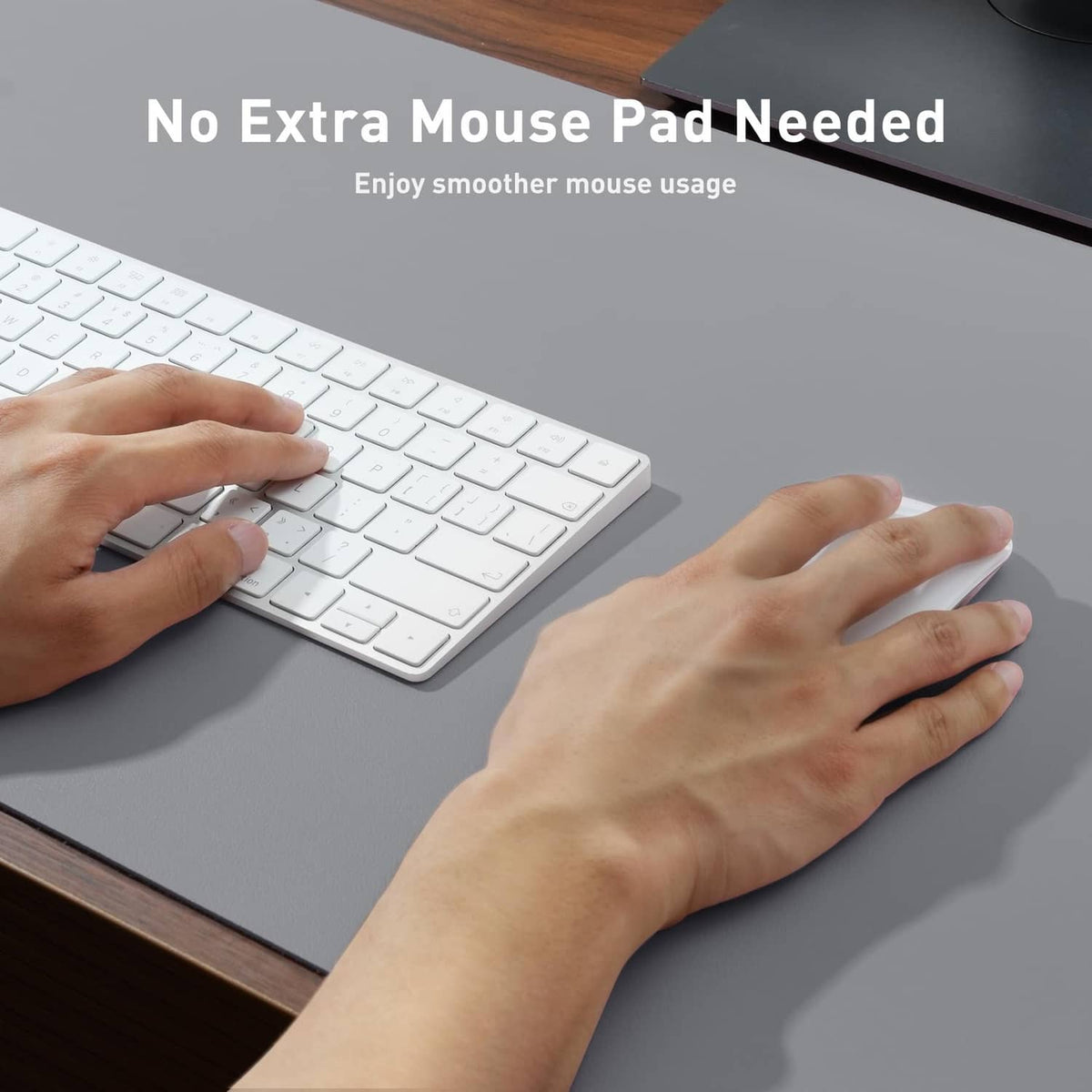 Light grey desk pad protector with hands smoothing over the surface