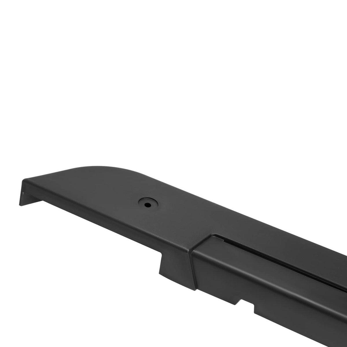 Close-up of black rocker panel rounded end with mounting hole.