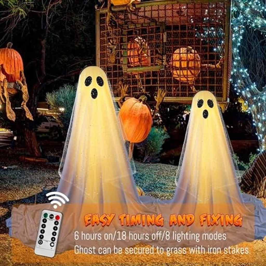 Set of two standing ghost decorations with black hats and dotted faces, glowing yellow sheer fabric.