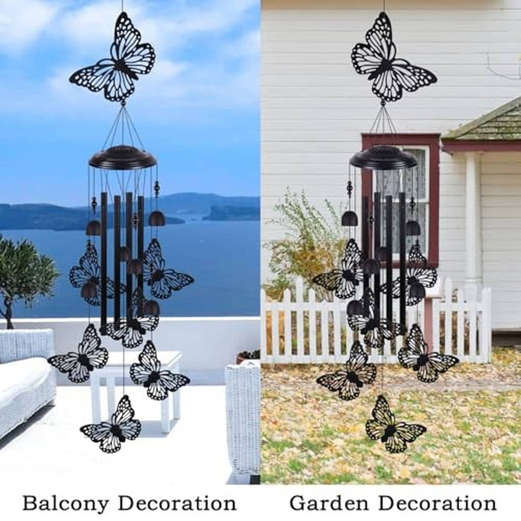 Black butterfly wind chime with five vertical bars and hanging butterfly accents