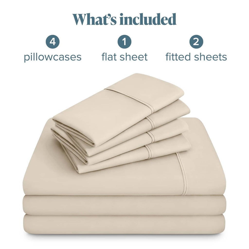 Stack of folded cream sheet set components: flat sheet and fitted sheets, with pillowcases