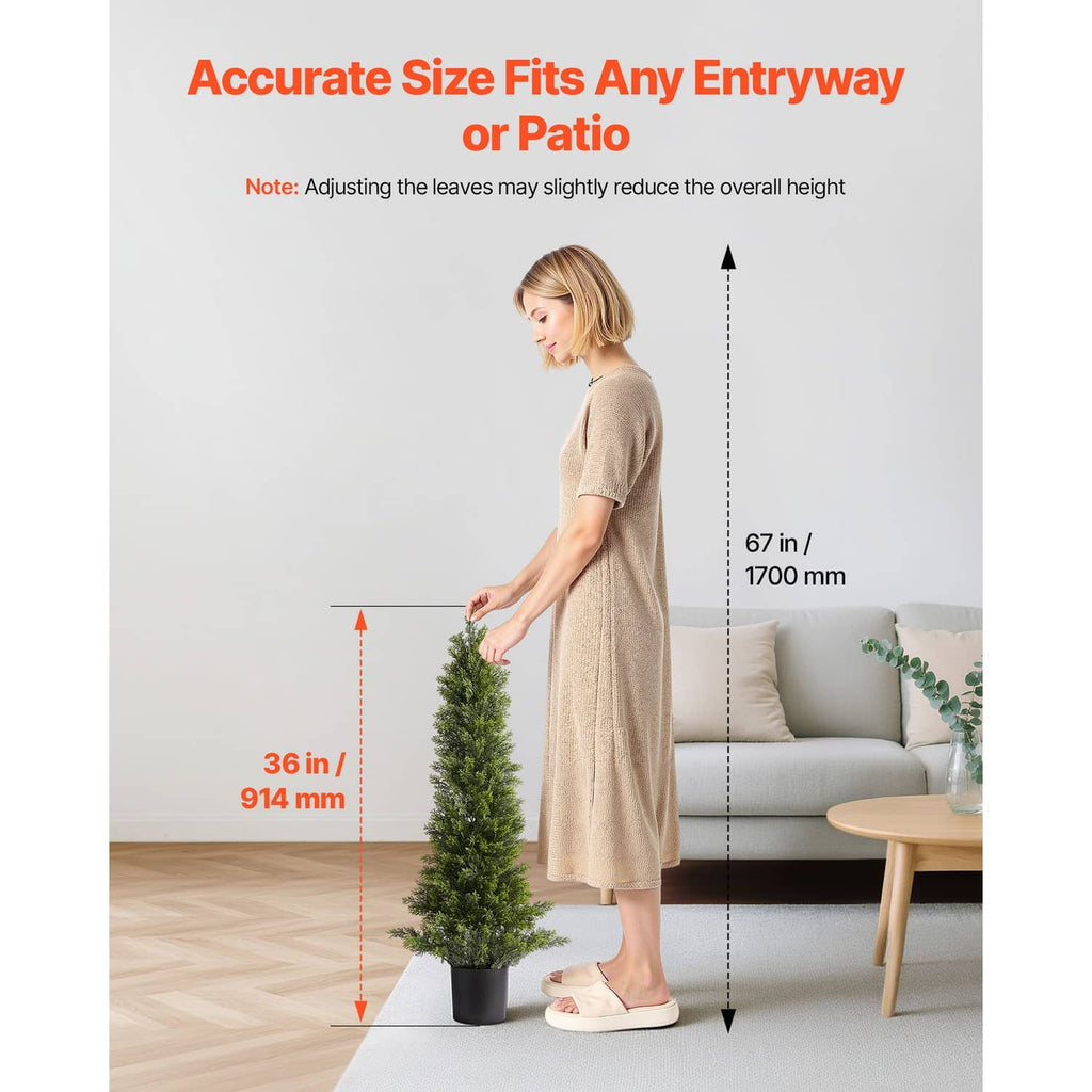 Artificial cedar topiary tree with green needles in black pot, sized for entryways
