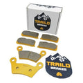 Ceramic brake pad set with front and rear pads, yellow backing, Trail Brakes box