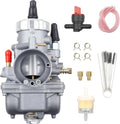 2-stroke carburetor with red fuel line, fittings, oil filter, clamps, and jets
