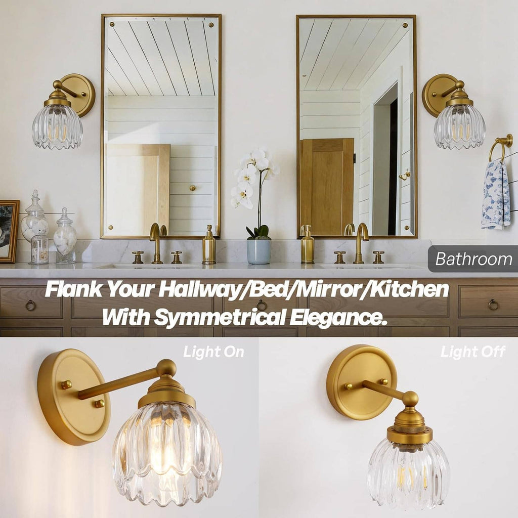 Pair of vintage tulip glass wall sconces with clear ribbed shades on antique brass mounts