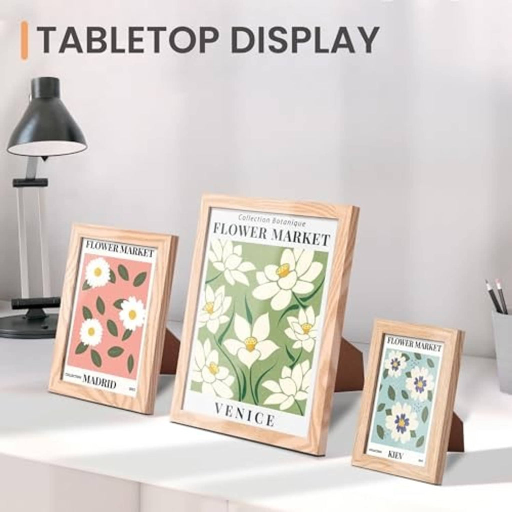 Tabletop natural wood picture frames set with botanical prints in vertical frames
