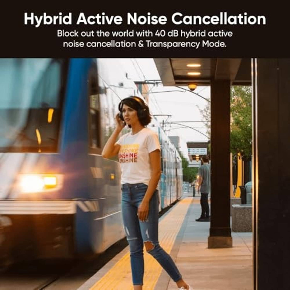 Over-ear wireless noise-cancelling headphones worn by a person outdoors.