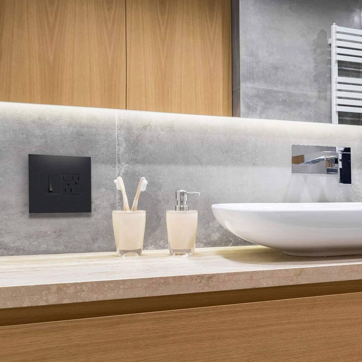 2-gang graphite wall plate with two switches on a bathroom wall