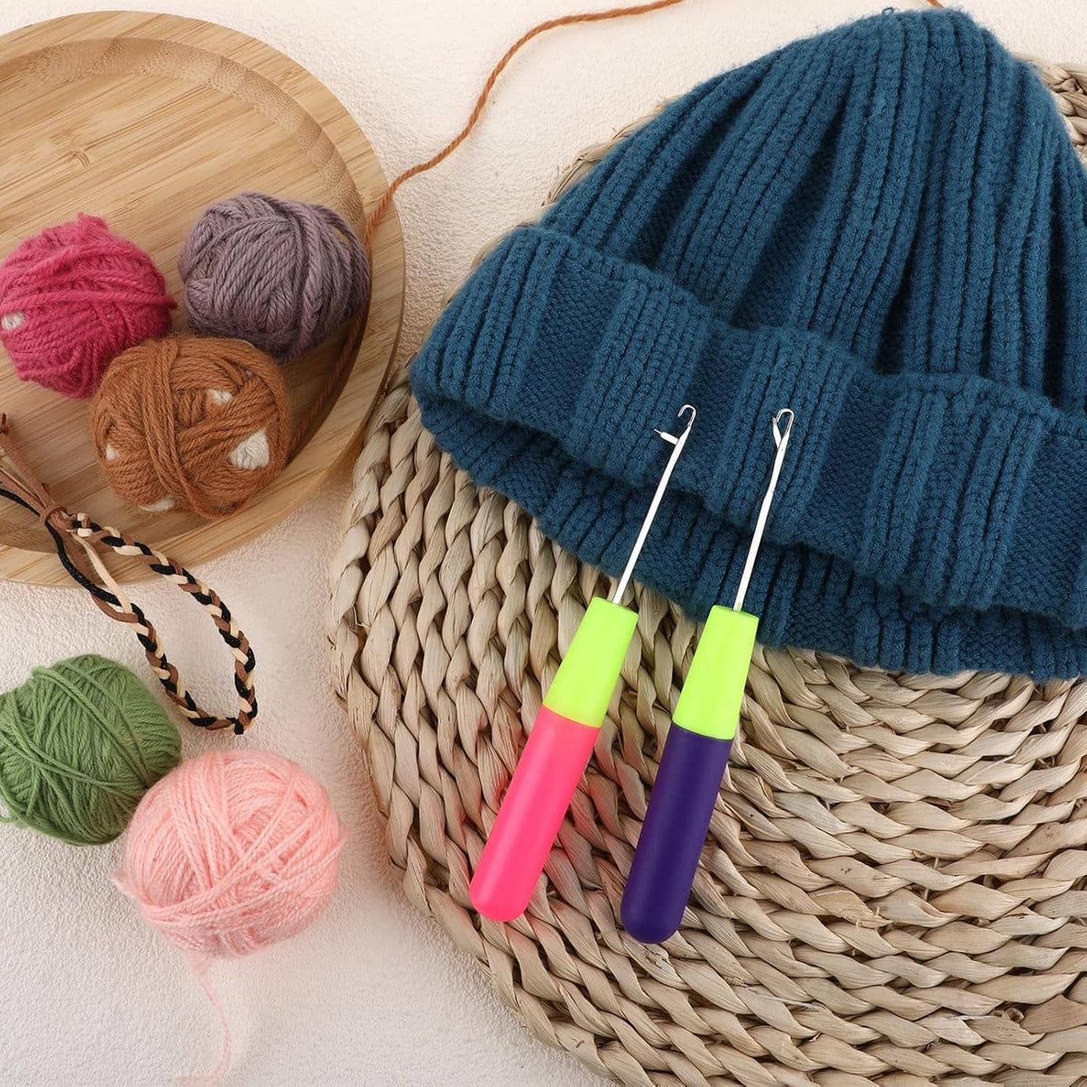 Latch hook crochet tools, neon green handles with pink and purple grips, metal latch hooks