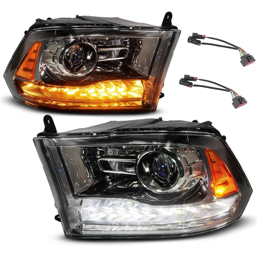 Two black projector headlights with chrome lens, amber turn signal lights, and wiring
