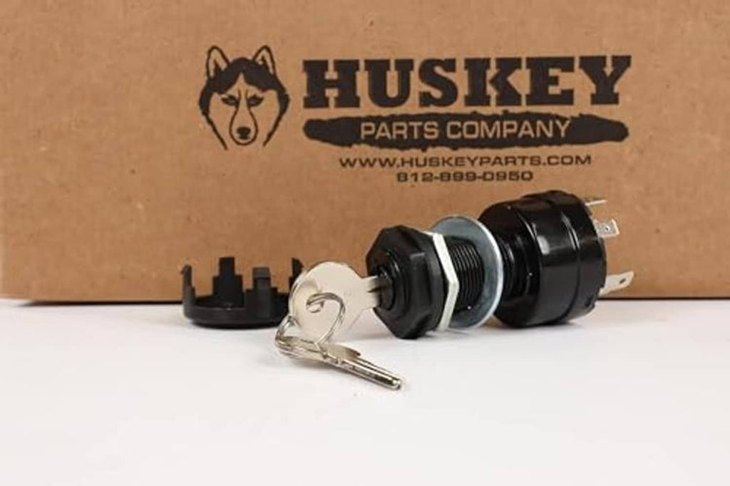 Golf cart ignition key switch with metal keys, showing black housing and terminals