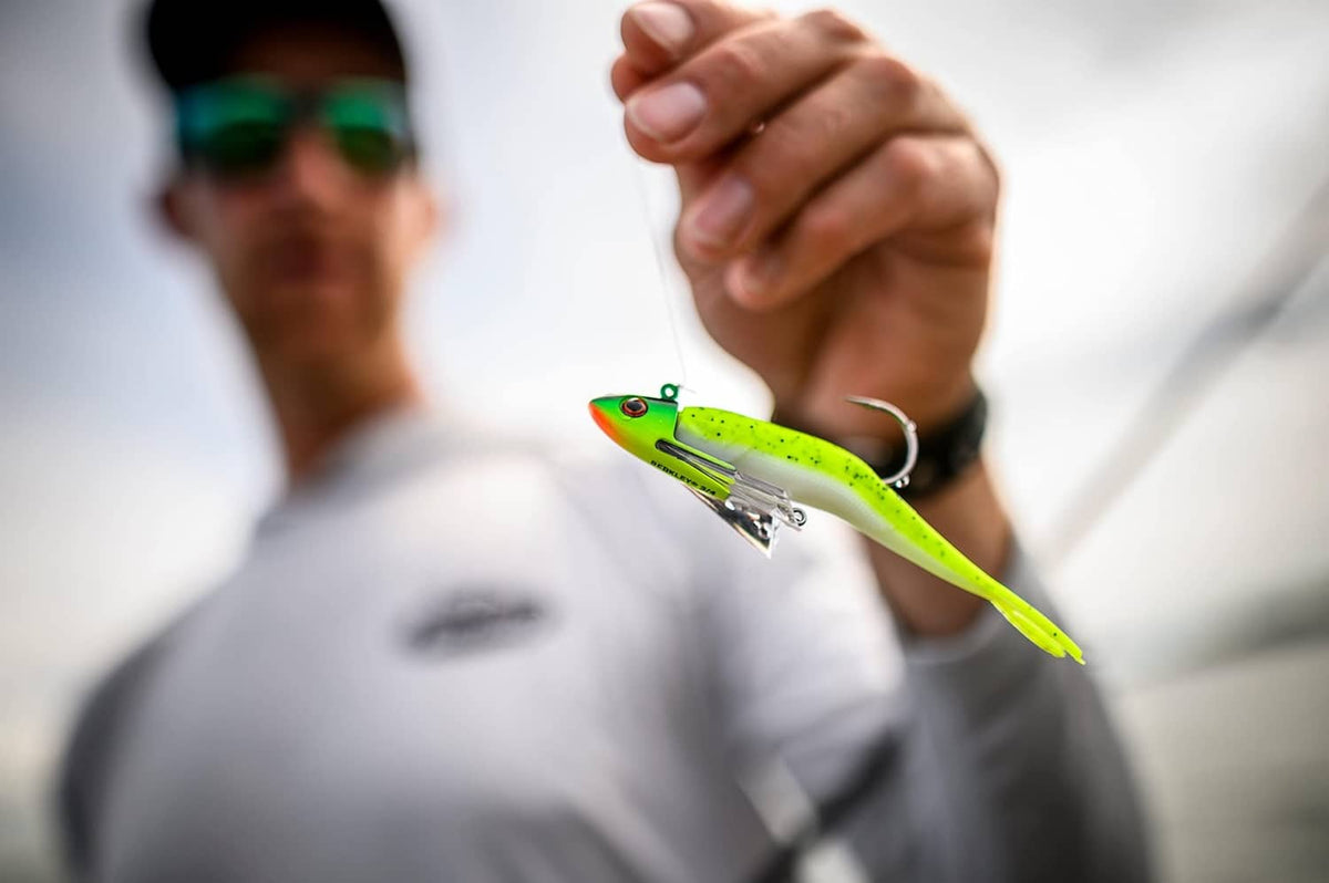 Green chartreuse minnow soft fishing lure with silver hook hardware