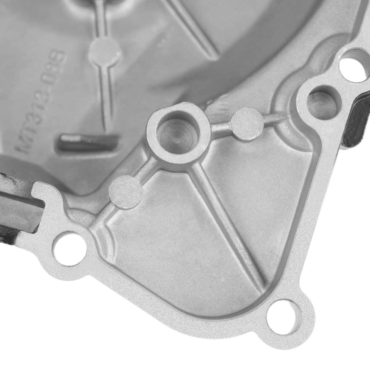 Close-up of silver cover with bolt holes and raised rib details