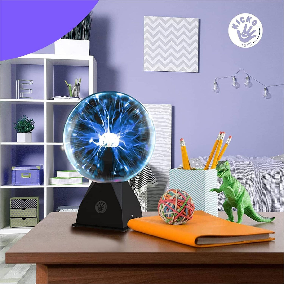 Plasma ball on black stand showing bright blue lightning effect