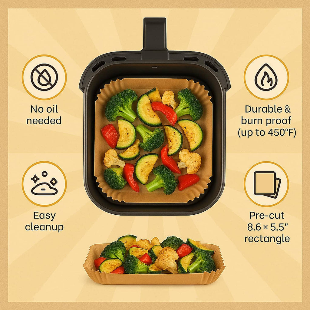Tan rectangle paper liner with scalloped edges inside an air fryer basket with vegetables