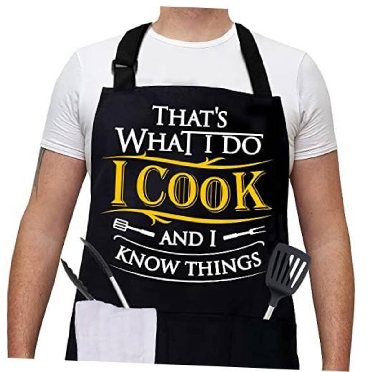 Black cross-back grilling apron with large pocket and 'I Cook' chest print
