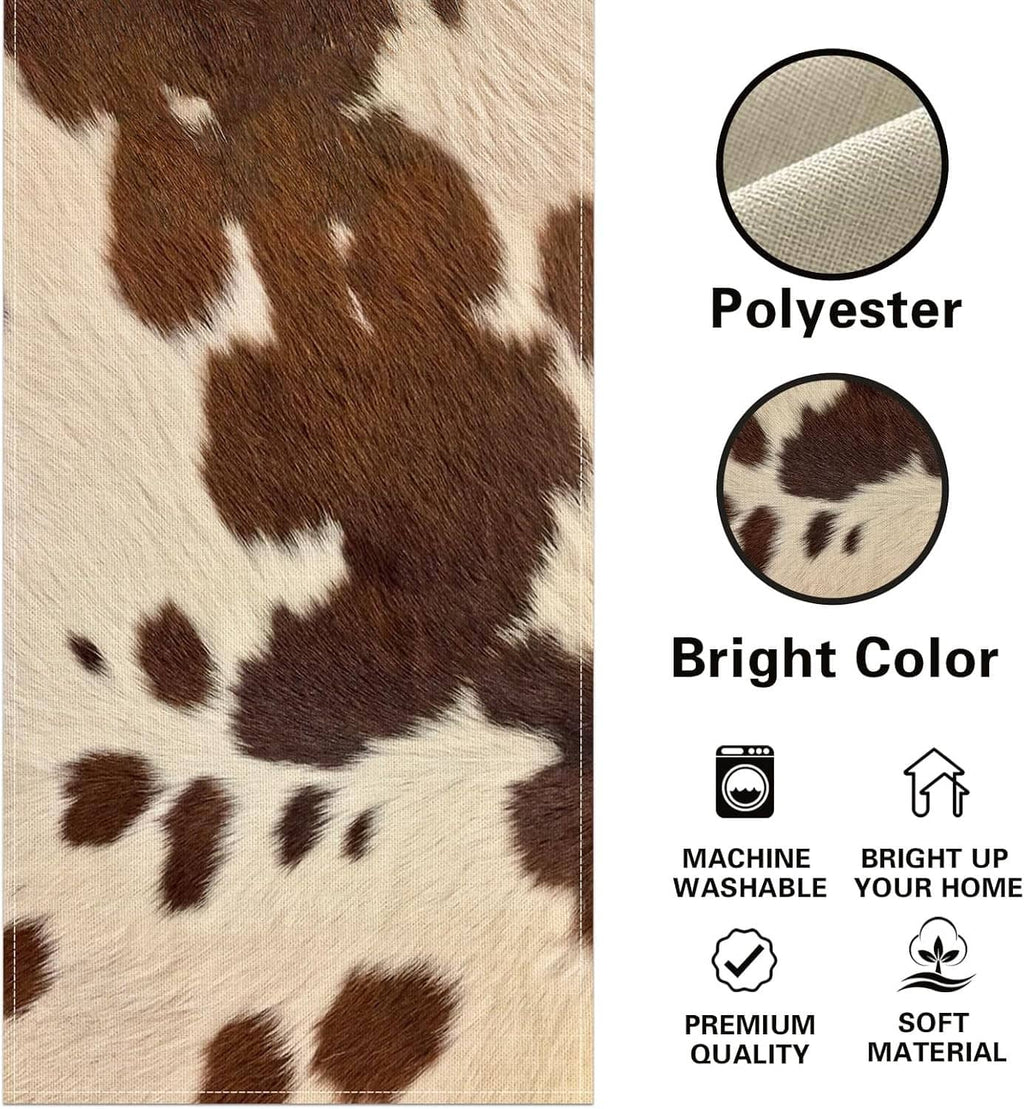 Cow print table runner fabric close-up in brown and white on tan base, polyester