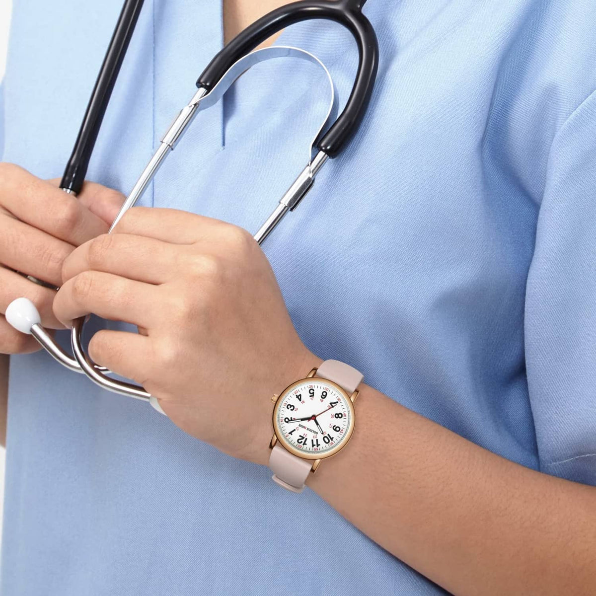 Rose gold nurse watch with white dial and red numerals on blush silicone strap